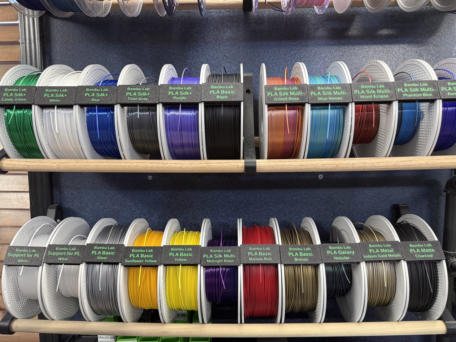 Label clips on spools stored on a shelf